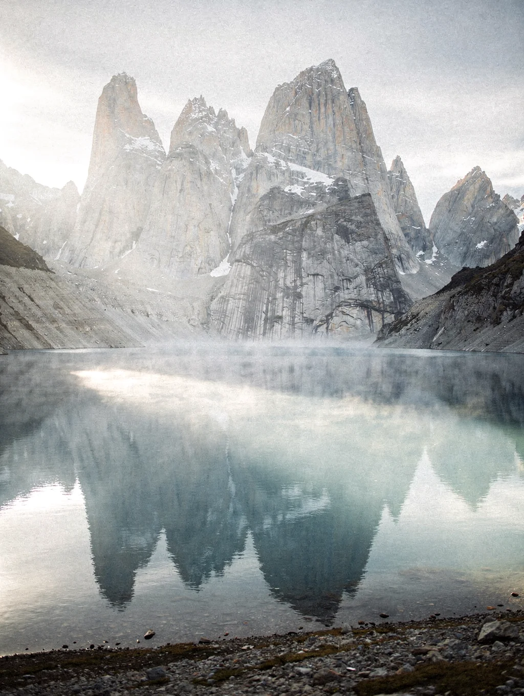 Massive granite horns above glacial lake in Chilean Patagonia