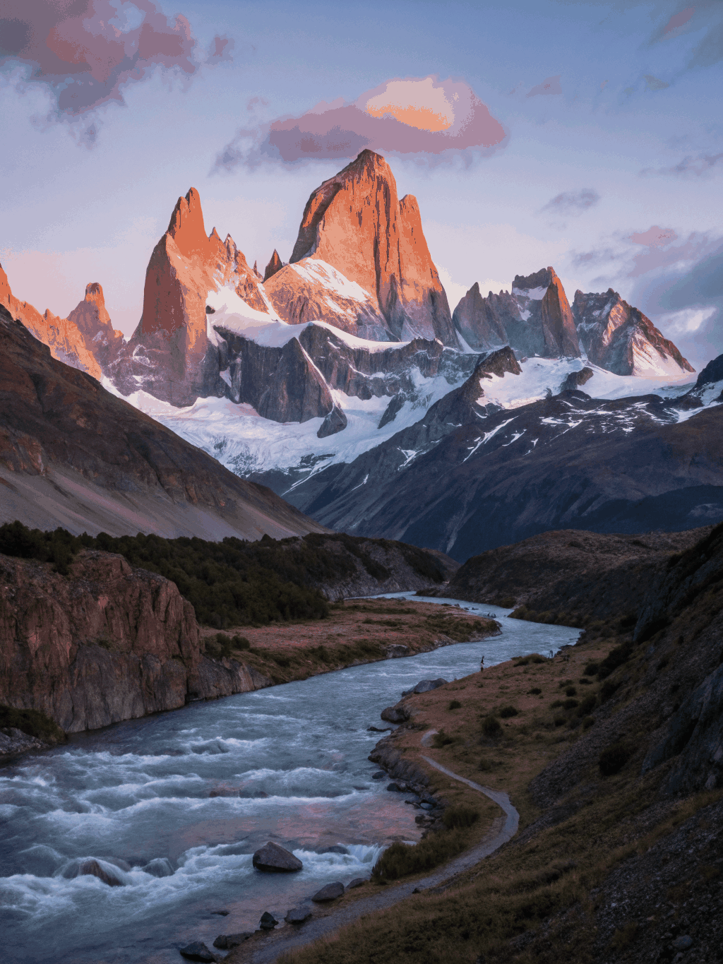 Granite spire peak of Mount Fitz Roy illuminated by morning light
